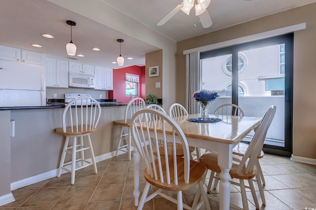 dining room with ceiling fan and light tile patterned floors