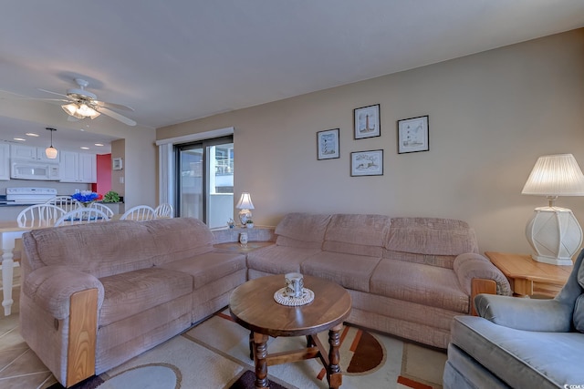 tiled living room featuring ceiling fan