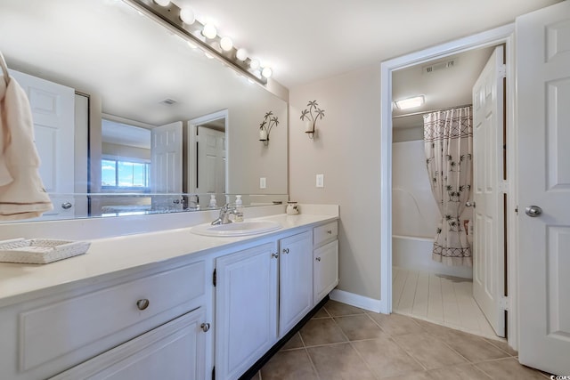 bathroom featuring shower / bath combination with curtain, tile patterned flooring, and vanity