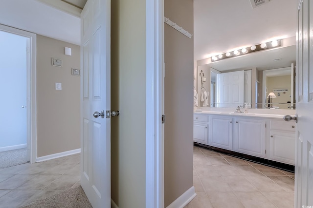 bathroom with tile patterned flooring and vanity