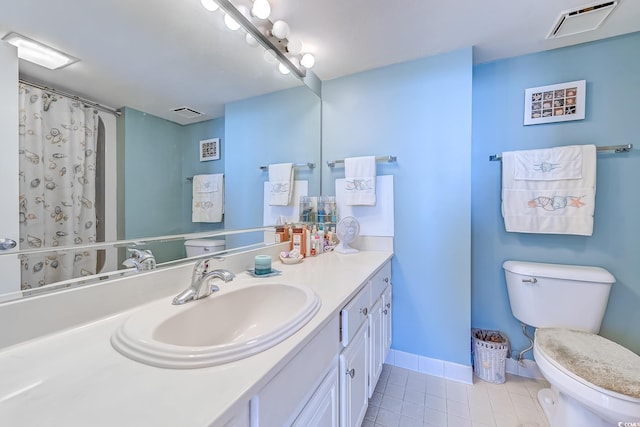 bathroom with vanity, a shower with curtain, tile patterned flooring, and toilet