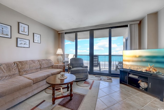 tiled living room with floor to ceiling windows