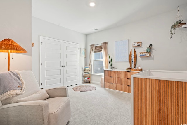 living area featuring carpet floors