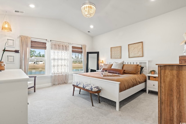 carpeted bedroom featuring lofted ceiling