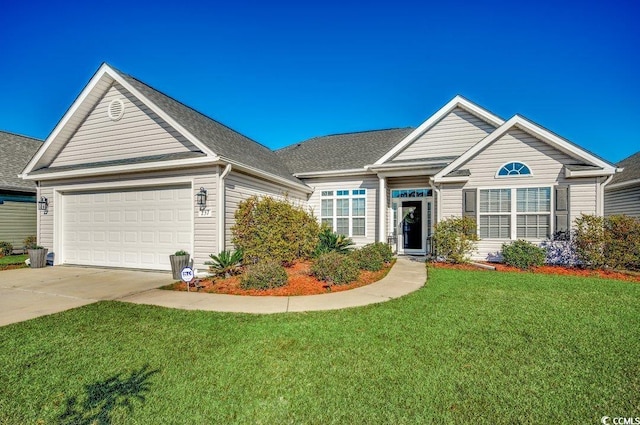 view of front of home with a front lawn and a garage