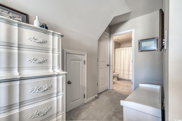 interior space featuring light countertops and light colored carpet