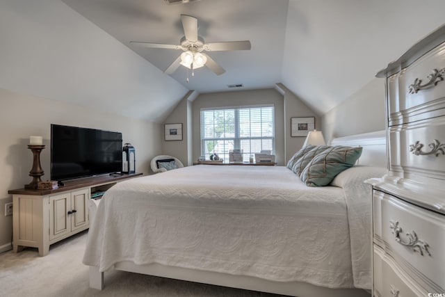 bedroom with vaulted ceiling, ceiling fan, visible vents, and light colored carpet