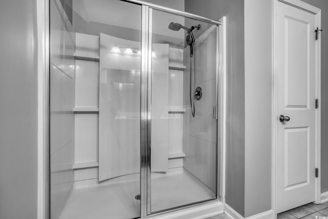 full bath featuring a shower stall