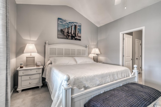 carpeted bedroom with vaulted ceiling