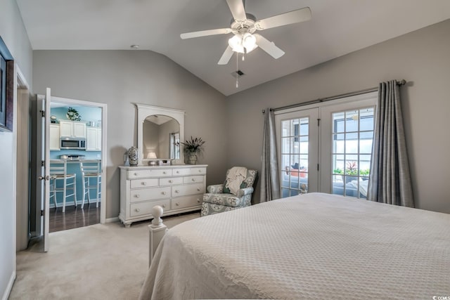 bedroom featuring access to outside, light colored carpet, vaulted ceiling, and ceiling fan