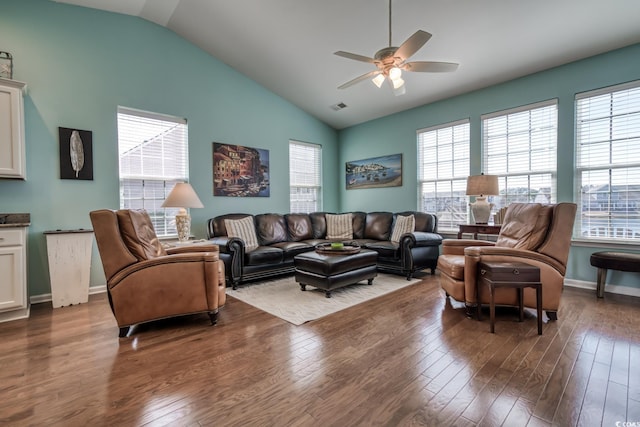 living room with dark wood-style flooring, visible vents, and a healthy amount of sunlight