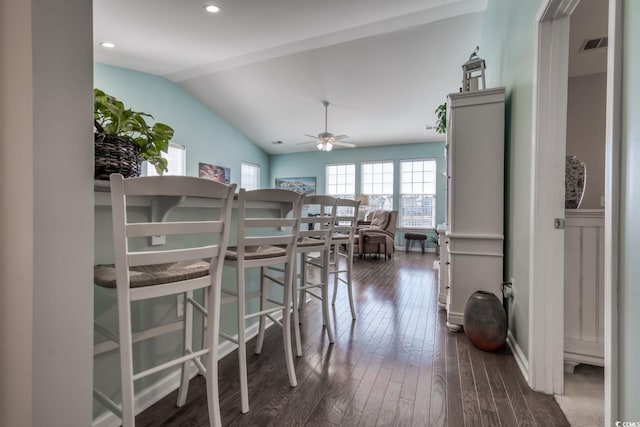 dining space featuring lofted ceiling, recessed lighting, visible vents, dark wood-type flooring, and a ceiling fan