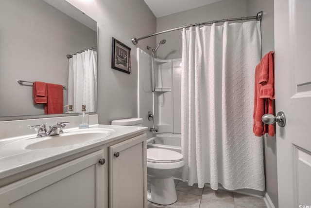 full bathroom featuring toilet, tile patterned flooring, vanity, and shower / tub combo with curtain