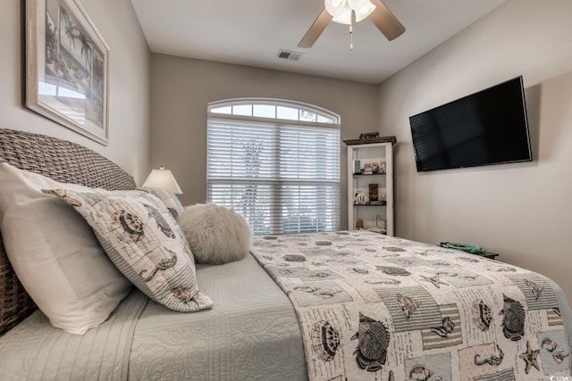 bedroom with visible vents and a ceiling fan