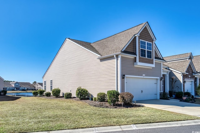 view of side of property with a garage, concrete driveway, a yard, and a shingled roof