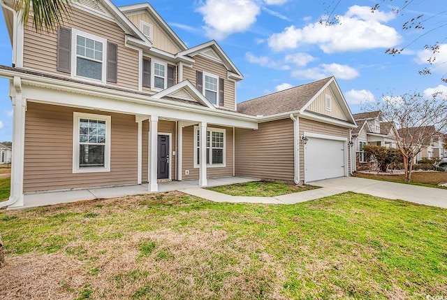 view of front of home featuring covered porch, driveway, a front yard, and an attached garage