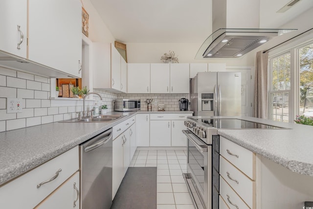 17 Racquet Club Dr, Pawleys Island, SC 29585 - kitchen featuring appliances with stainless steel finishes, a sink, light countertops, backsplash, and light tile patterned floors
