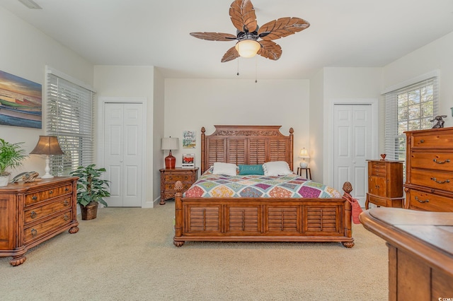 17 Racquet Club Dr, Pawleys Island, SC 29585 - bedroom featuring light carpet, ceiling fan, and two closets