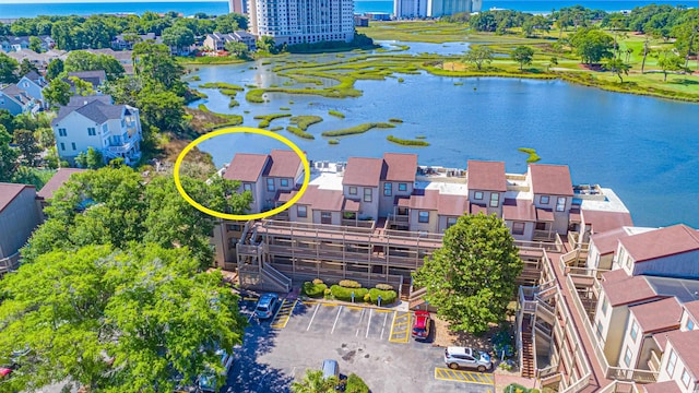 birds eye view of property with a water view