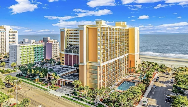 view of property featuring a water view and a view of the beach