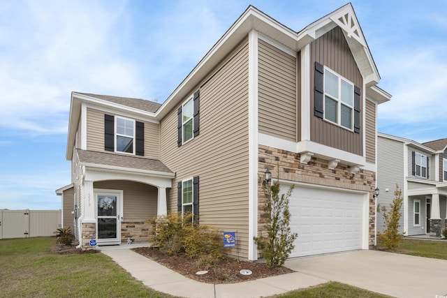 view of front of house with a garage and a front lawn