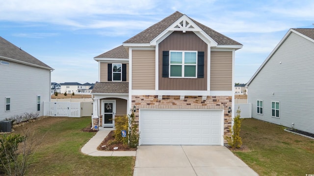 view of front of home featuring a front lawn and a garage