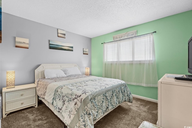 carpeted bedroom with a textured ceiling