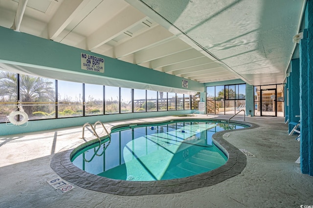 view of swimming pool featuring a patio area