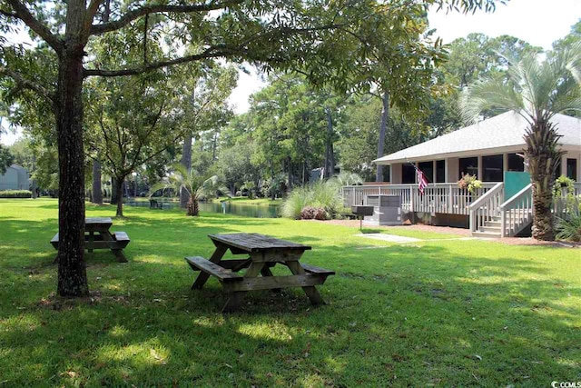 219 Salt Marsh Cir Unit 14A, Pawleys Island, SC 29585 - view of grassy yard with a wooden deck