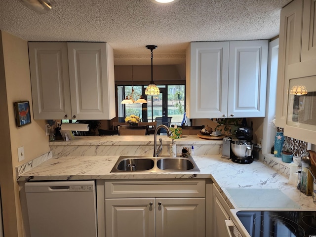 219 Salt Marsh Cir Unit 14A, Pawleys Island, SC 29585 - kitchen with white appliances, light countertops, white cabinets, a textured ceiling, and hanging light fixtures