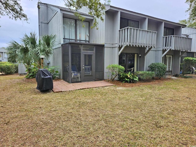 219 Salt Marsh Cir Unit 14A, Pawleys Island, SC 29585 - rear view of house with a lawn