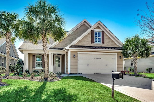 view of front facade featuring a front yard and a garage