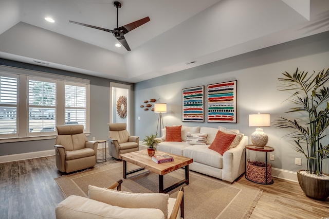 living room with ceiling fan and wood-type flooring