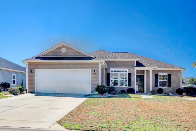 ranch-style home with a garage and a front yard