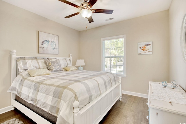 bedroom featuring ceiling fan and dark hardwood / wood-style flooring