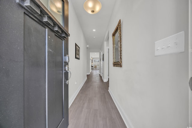 hallway featuring hardwood / wood-style flooring