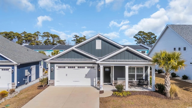 craftsman inspired home with a garage and a porch