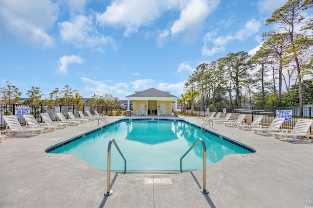 view of swimming pool with a patio area