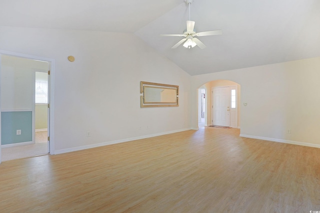 unfurnished living room with light wood-type flooring, lofted ceiling, and ceiling fan