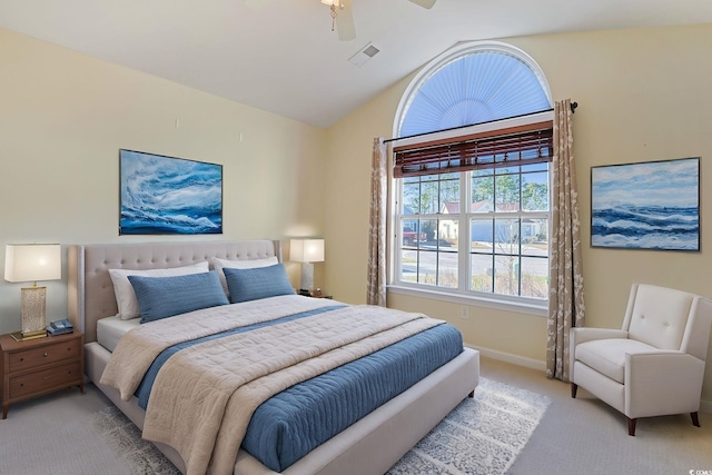 bedroom featuring lofted ceiling, light colored carpet, and ceiling fan