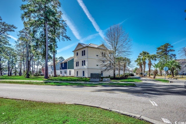 view of property exterior featuring a yard