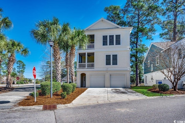 view of front of house featuring a garage and a balcony