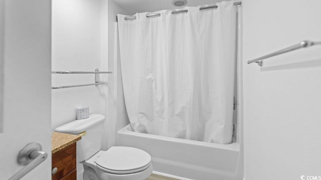 full bathroom with vanity, toilet, and shower / bath combo with shower curtain