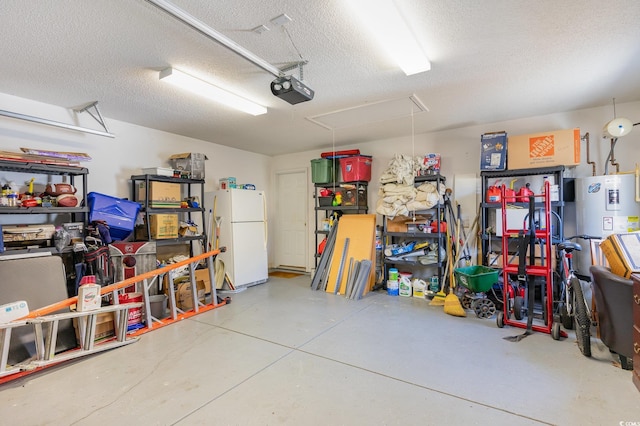 garage with white fridge, water heater, and a garage door opener