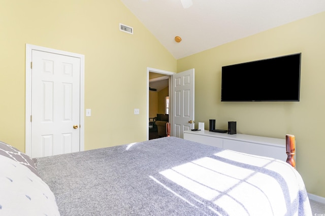 bedroom with high vaulted ceiling