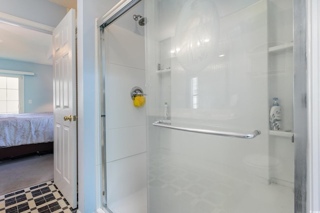 bathroom featuring a shower with door