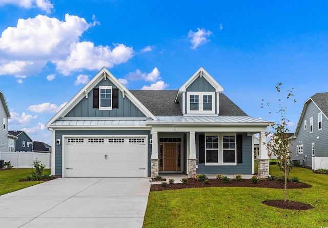 view of front of property with a garage and a front yard