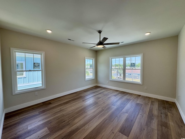 unfurnished room featuring visible vents, baseboards, ceiling fan, dark wood-type flooring, and recessed lighting
