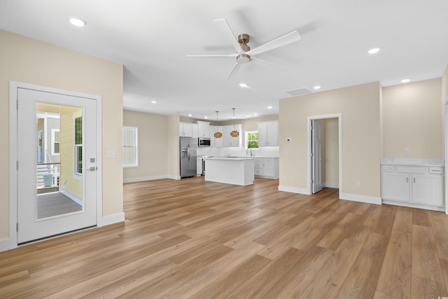 713 9th Ave S, North Myrtle Beach, SC 29582 - unfurnished living room with ceiling fan, light wood-style floors, and recessed lighting