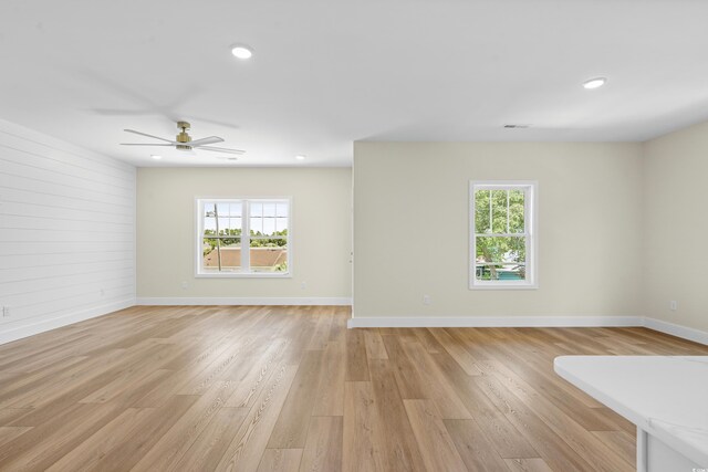 713 9th Ave S, North Myrtle Beach, SC 29582 - spare room with healthy amount of natural light, light wood-type flooring, ceiling fan, and recessed lighting